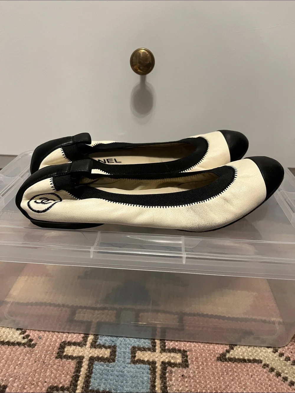 CHANEL Cream Leather Ballet Flats with Black Cap Toes